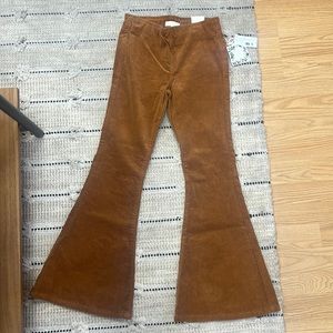Cute corduroy rust colored, wide bottom, bought for my daughter, never worn!